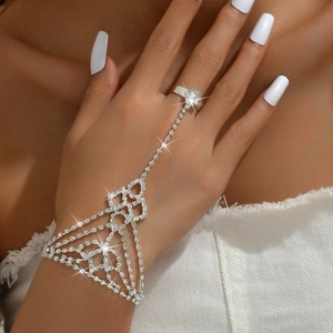Sparkling rhinestone hand harness featuring a silver-toned geometric mesh ring and bracelet