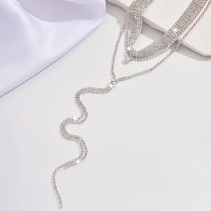 Exaggerated multi-layer rhinestone necklace with oval crystals and wavy silver tassels