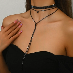 Exaggerated black rhinestone choker set with layered necklace and drop pendant design