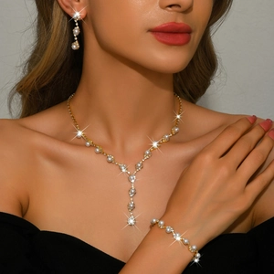 Elegant bridal jewelry set with sunflower rhinestone pearls and gold necklace on model