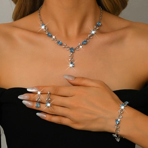 Elegant leaf vine jewelry set with blue water drop crystals and silver finish