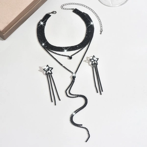 Detailed shot of black rhinestone choker necklace and star fringe earring set