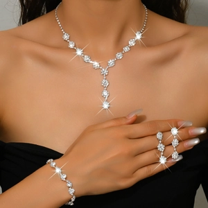 Elegant bridal jewelry set with Y-shaped rhinestone necklace, bracelet and drop earrings