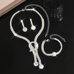 Macro detail of elegant silver-tone bridal jewelry set with sparkling rhinestones