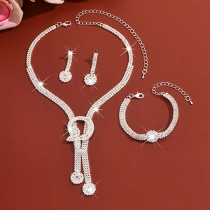 Macro view of bridal rhinestone jewelry set including necklace, bracelet and earrings