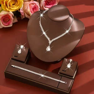 Luxurious silver-plated bridal jewelry set with sparkling crystals and teardrop pendants