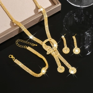 Macro detail of gold bridal jewelry set with sparkling rhinestones and elegant tassels