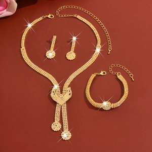 Detailed view of luxury bridal crystal jewelry set with sparkling rhinestones and gold finish