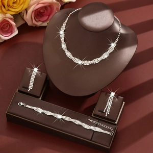 Elegant sparkling rhinestone jewelry set with twisted necklace, bracelet, and fringe earrings