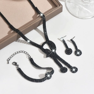 Exquisite black rhinestone bridal jewelry set featuring necklace, bracelet and earrings