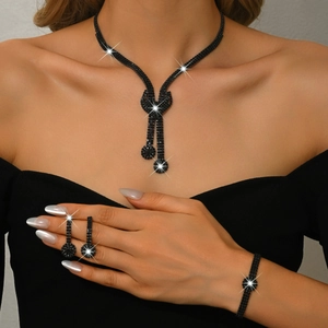 Detailed view of bridal crystal jewelry set with black rhinestone necklace and earrings
