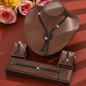 Detail of elegant black crystal necklace, bracelet, and drop earrings set for brides
