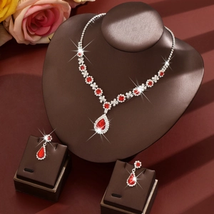 Exquisite bridal jewelry set with red teardrop gems and silver chain for weddings