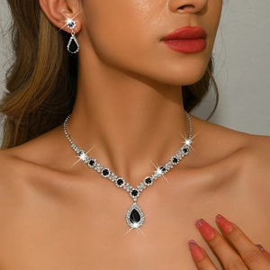 Elegant silver bridal jewelry set with black teardrop pendant necklace and drop earrings