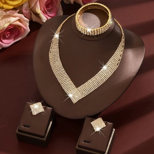 Luxurious gold-tone V-shaped bridal jewelry set with sparkling rhinestones and earrings