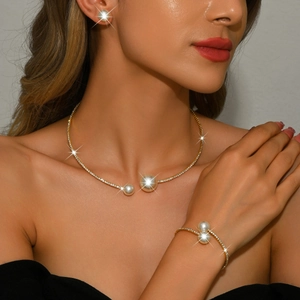 French style gold jewelry set with white pearls and sparkling rhinestones on model