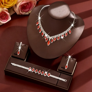 Elegant bridal jewelry set with red teardrop crystals and sparkling rhinestones