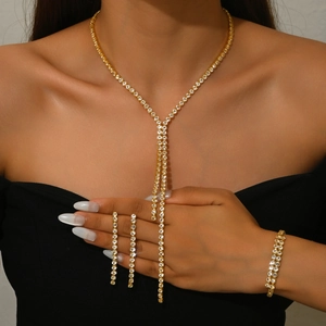 Elegant gold-tone jewelry set with sparkling rhinestones including necklace and earrings