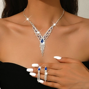 French palace style necklace and fringe earrings set with blue pear-shaped gemstones