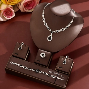 Elegant silver-toned bridal jewelry set with black teardrop gemstones and white crystals