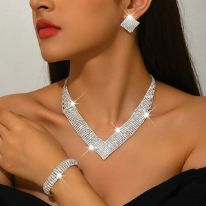 Luxury V-shaped rhinestone bridal jewelry set with sparkling necklace, bracelet, and earrings