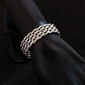 Silver woven braided open bangle cuff bracelet in minimalist ethnic vintage style