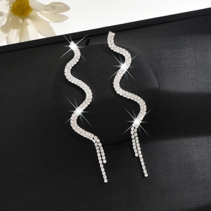 Sparkling silver snake-shaped dangle earrings with rhinestones for a trendy commute look