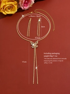 Detail of butterfly necklace and tassel earrings set with shimmering rhinestones