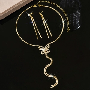 Elegant gold butterfly necklace and long tassel earrings set with sparkling crystals