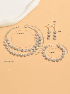 Detailed view of silver sunflower jewelry set with size measurements for necklace and earrings