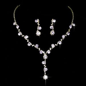 Detailed view of glittering crystal bridal jewelry set with necklace and drop earrings