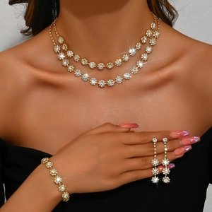 Detail shot of a double-layer sunflower rhinestone necklace and earrings set worn by a model