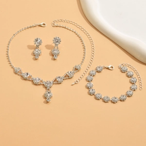 Detailed view of silver bridal jewelry set with sparkling blue and clear rhinestones