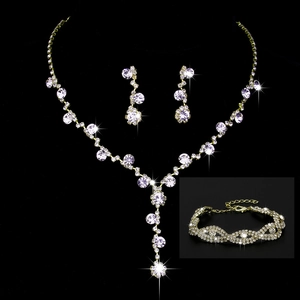 Close-up of golden sunflower bridal jewelry set with sparkling rhinestones and pearls