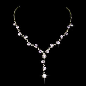 Close-up of bridal Y-shaped silver necklace with sunflower rhinestone tassels on black backdrop