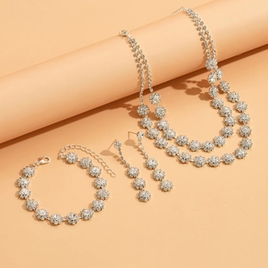 Detailed view of silver sunflower necklace set with sparkling crystal rhinestones
