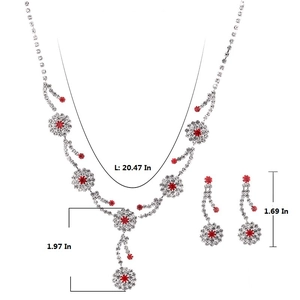 Detailed view of silver bridal jewelry set with red petal gems and white rhinestones