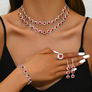 Elegant silver sunflower jewelry set with red rubies for weddings and formal parties