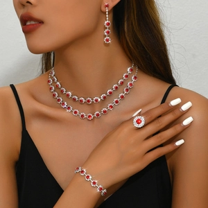 Detailed view of model wearing red sunflower jewelry set with halo diamond design