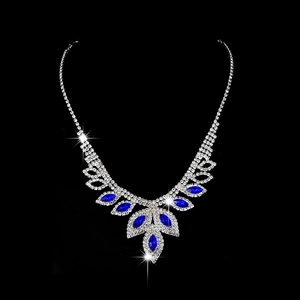 Macro shot of silver bridal necklace with blue marquise and teardrop rhinestones