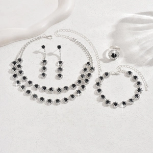 Close-up of a double-layer sunflower necklace and jewelry set with black stones