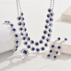 Macro shot of silver wedding jewelry set with royal blue sapphire and crystals