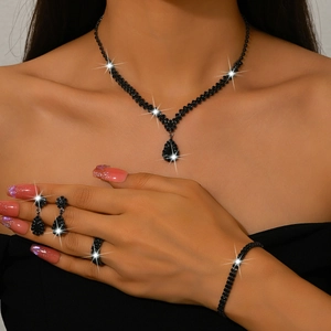 Luxury black zircon jewelry set including necklace, earrings, bracelet and ring on model