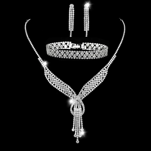 Silver bridal jewelry set with sparkling crystals, featuring tassel necklace and earrings