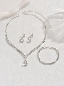 Detailed macro view of sparkling rhinestone bridal jewelry set with necklace and earrings