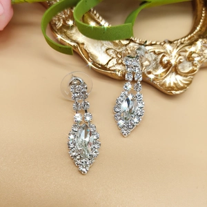 Detailed view of marquise-cut silver bridal earrings with sparkling zircon crystals