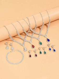 Detailed view of bridal jewelry sets in four colors with pear-cut crystals and bracelet