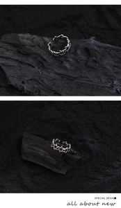 Macro shot of vintage silver hexagram ring with adjustable open band on black charcoal