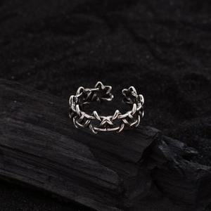 Vintage adjustable hexagram ring with gothic thorn design on a dark charcoal background