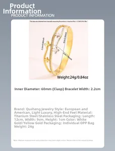 Détail du jonc en acier inoxydable bicolore à motif trèfle avec pavé de zircons et double rang